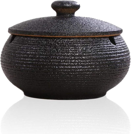 Lependor Black Ceramic Ashtray with windproof lid, displayed on a table, ideal for indoor or outdoor smoking, home, or office decoration.