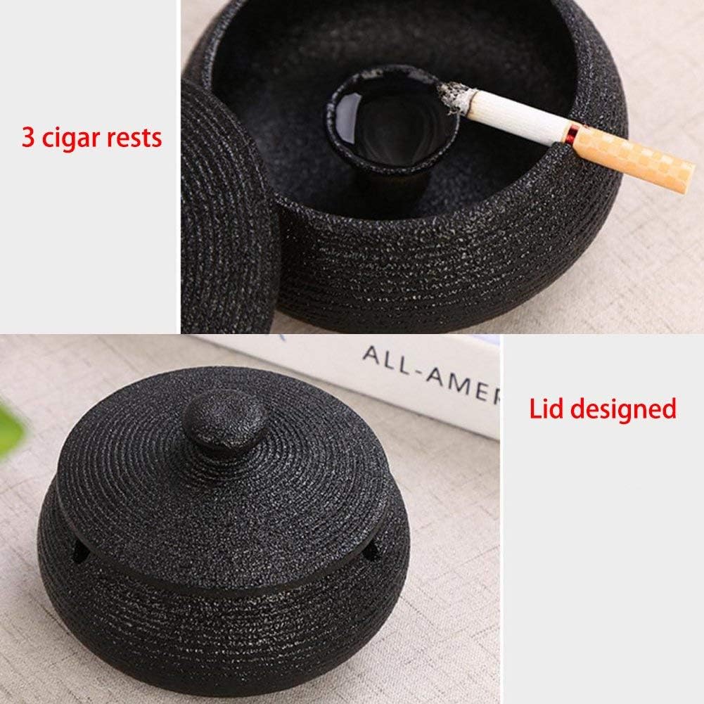 Lependor Black Ceramic Ashtray with windproof lid, displayed on a table, ideal for indoor or outdoor smoking, home, or office decoration.