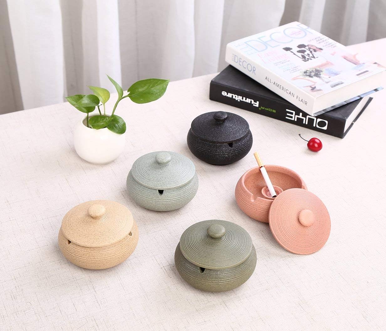 Lependor Black Ceramic Ashtray with windproof lid, displayed on a table, ideal for indoor or outdoor smoking, home, or office decoration.